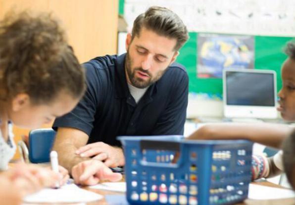 teacher and students at reading table
