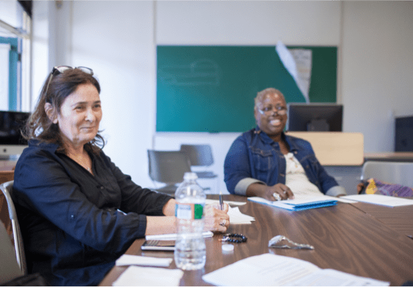 women sitting at a conference table