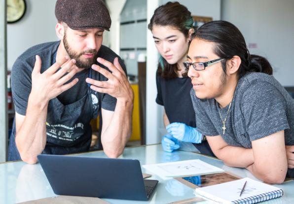 students looking at a laptop