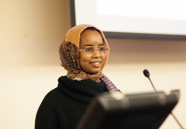 woman speaking at podium