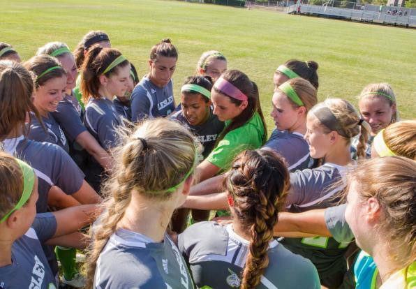 women's soccer team huddle