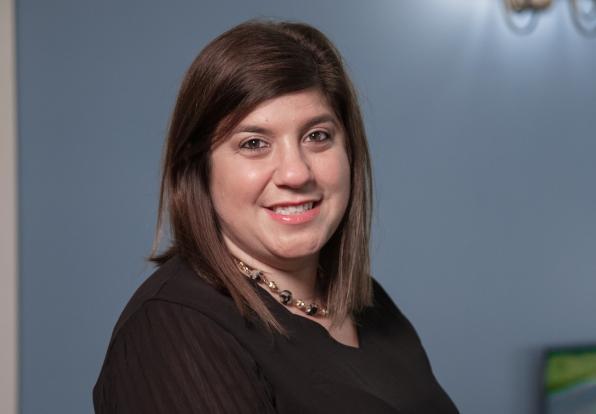 photo of Amanda smiling in a black shirt